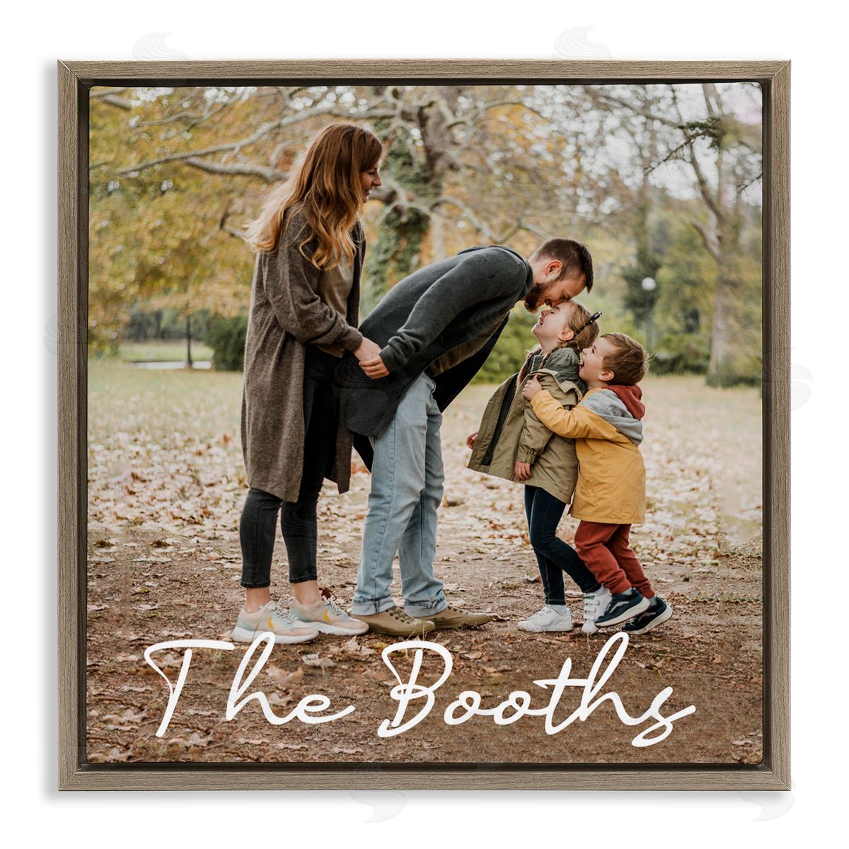 Custom family portrait labeled “The Booths” with parents and children laughing outdoors, framed in warm elm wood — heartfelt family art for a grateful dining room.